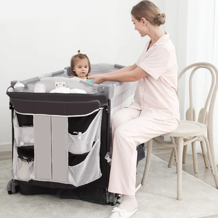 4-in-1 Convertible Baby Crib & Travel Playard with Changing Table and Organizer